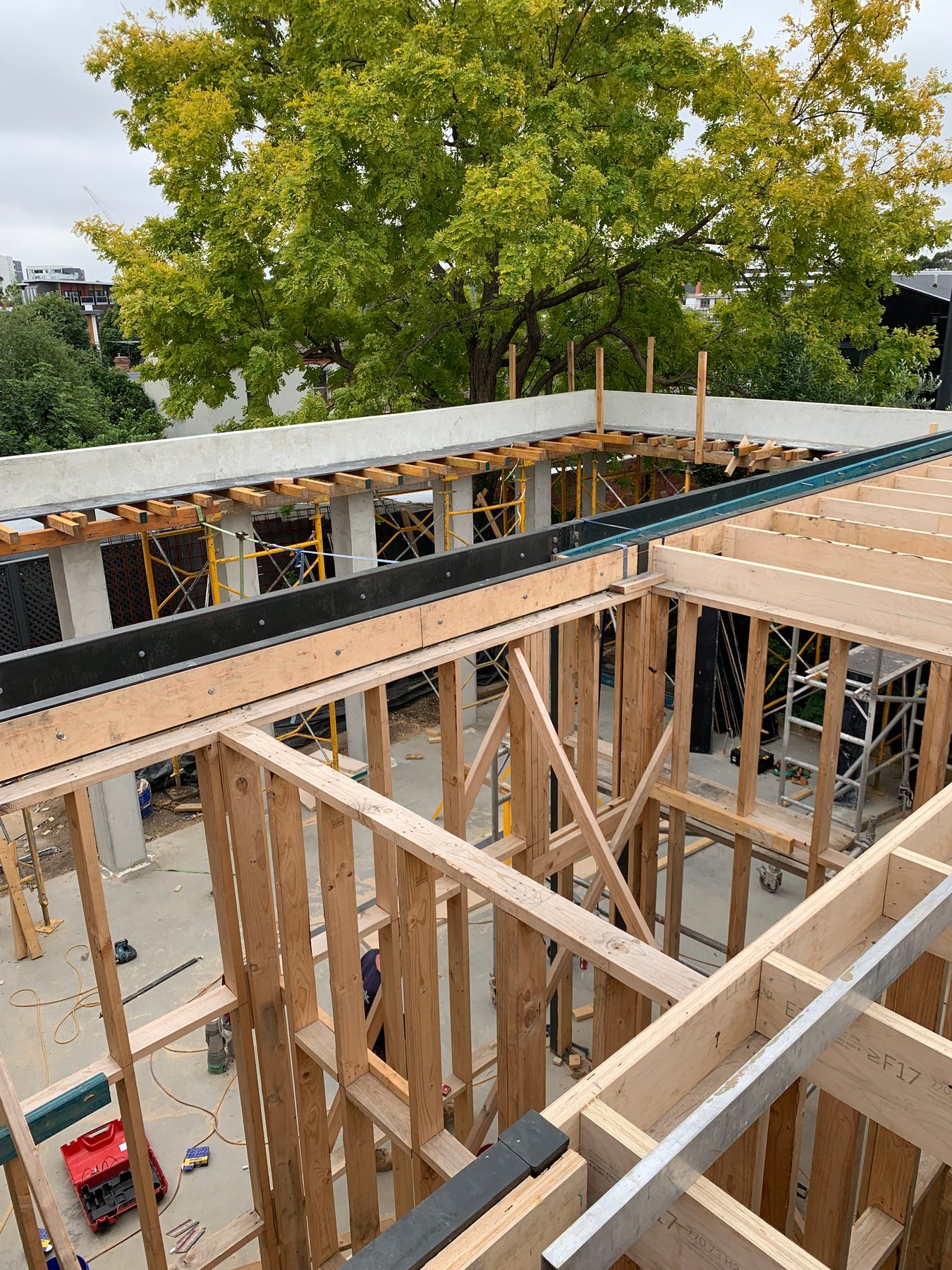 Aerial of a timber-framed build under construction